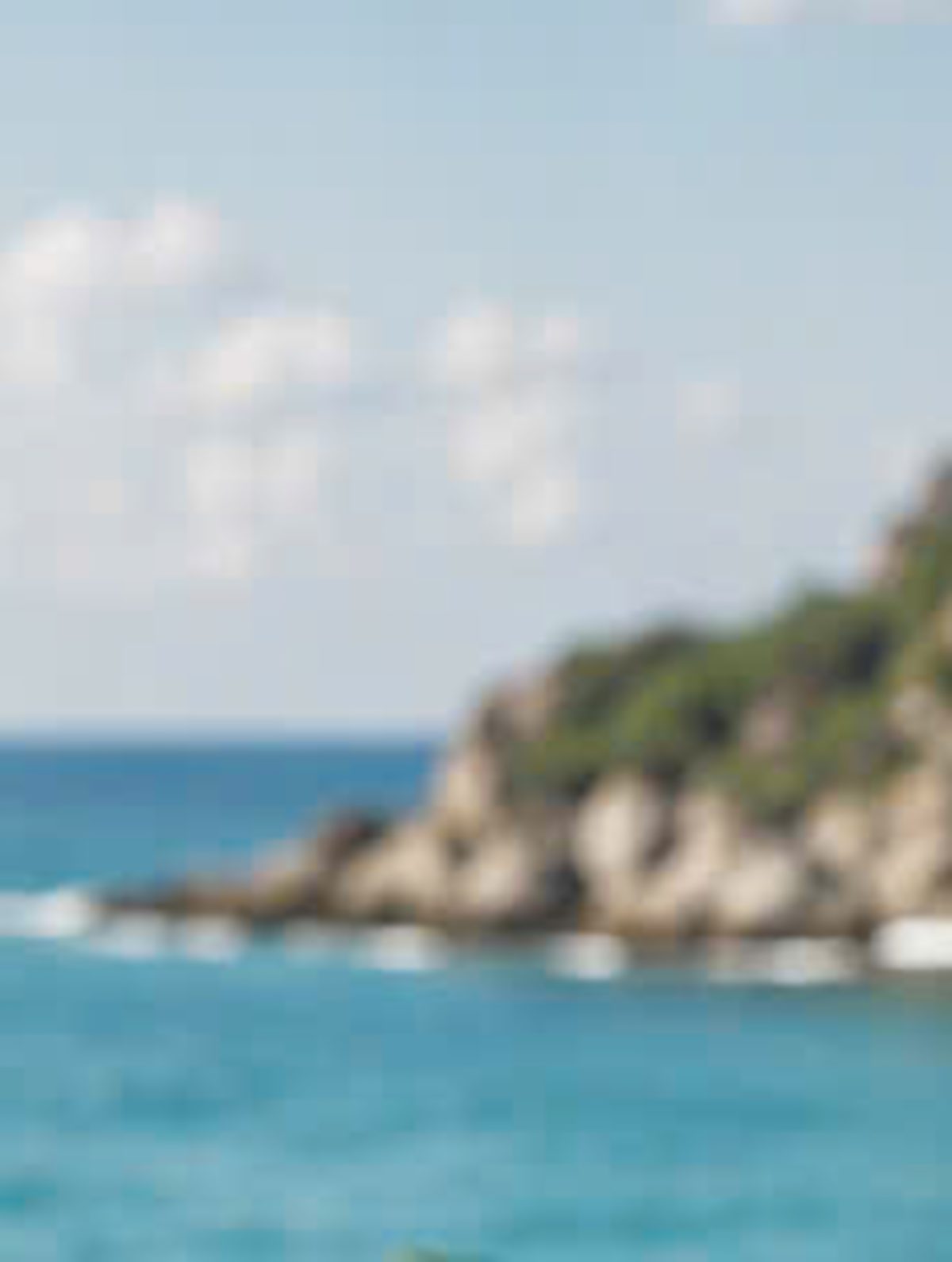 Turquoise sea and a rocky cove on the Vietnamese coast